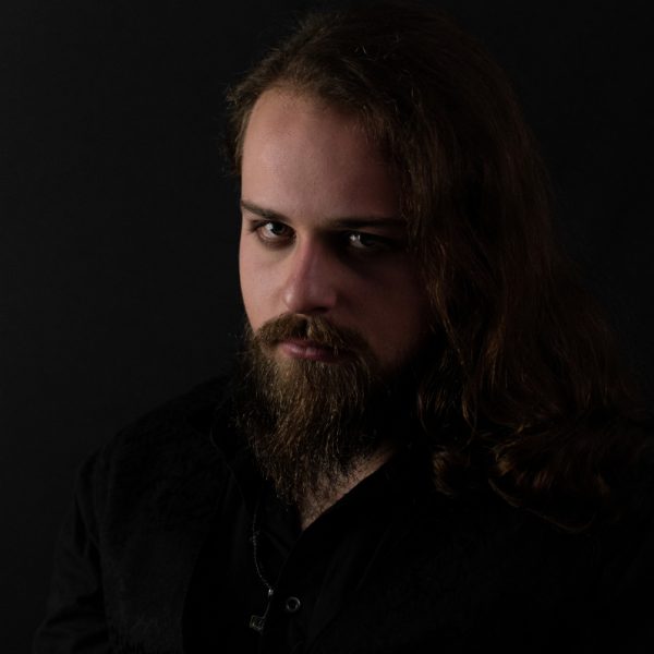  The strong hands of a monstrosity are smashing at the strings and are tearing sharp slits into the air. Im told, I don't need an amplifier but nobody can take that from me.
My name is Joel Hösterey and I play guitar for Coven Call. After a few years of abstinence, I finally want to play live again and I'm on pins and needles because we're soon hitting the stages.
Although it is true that I go berserk on my guitars, I can't overcome my obsession with gear: I have a collection of twelve guitars because more wouldn't fit my apartment. Plus, I have a fascination with floor-modeler amps like the Line6 Pod Go or more recently the Line6 HX Stomp. With that I conjure wicked sounds and stompy riffs.
Most of my guitars are Explorer models because one of my biggest idols in guitar playing and music as a whole is James Hetfield from Metallica. Aside from him, I bring a lot of Death Metal influence to Coven Call, inspired by bands like Gojira, LIK and Orbit Culture.
