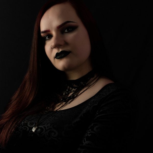 A thousand voices rest inside me. From the growl of the beasts to the soft breeze of the wind spirits. But promise, I won't pull sailors to the depths – not on purpose.
My name is Linda Hennen, vocalist for Coven Call. With the guys, it's the farthest I've ever gotten with a band! I'm super exited and looking forward to everything to come.
My first memories of music is me dancing to ACDC with my father – a distant bliss that later gave way to a dark reality, which, for one thing, is subject of many of my lyrics but also the source of a spite that led me to where I am: unimpressed by long travels, high expectations and growning steps out of my comfort zone. But that is what you do, when you feel that you want more, so much, that you believe you need more. And that is how I crave this work with Joel, Jason, Moritz and Yves.
Since being a toddler, my musical influences have changed of course and so, my practice playlist today mostly consists of Nightwish, Epica and Seven Spires. 