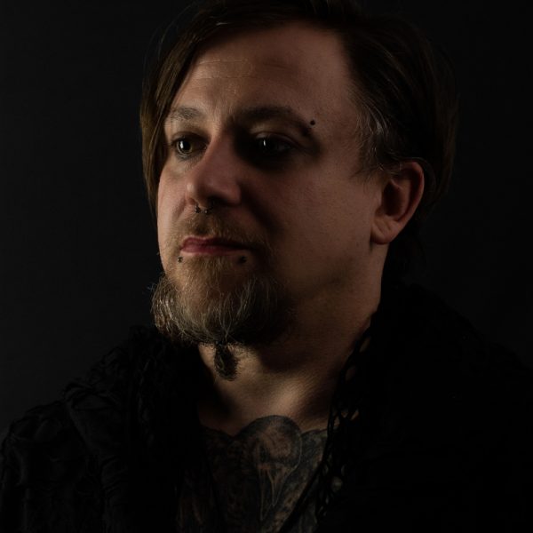 The ground trembles. Massive wires vibrate, sound waves penetrate the bone and shake guts to the core. Like the rumble of a force of nature approaching.
I'm Yves Vogl, bass player with Coven Call. After a few years in different music projects, I would like to dedicate my heart and soul to a band in which I can develop long-term.
Records, mixtapes and CDs by my father surrounded me growing up, which piled up from his days as a bartender in the 70s. Early musical education was important to him - so at the age of five he gave me Metallica's Kill'em All in my hand to prevent me from going down the wrong path musically. That happened around the time Cliff Burton tragically died.
Over the years I've played in a few bands and projects, gaining experience on stage and in the studio, rarely sticking to one genre: from NWOBH to punk and jazz to gothic rock and late 90's nu-metal. Bands like Type O Negative, Hypocrisy and Machine Head had a special influence on me. 